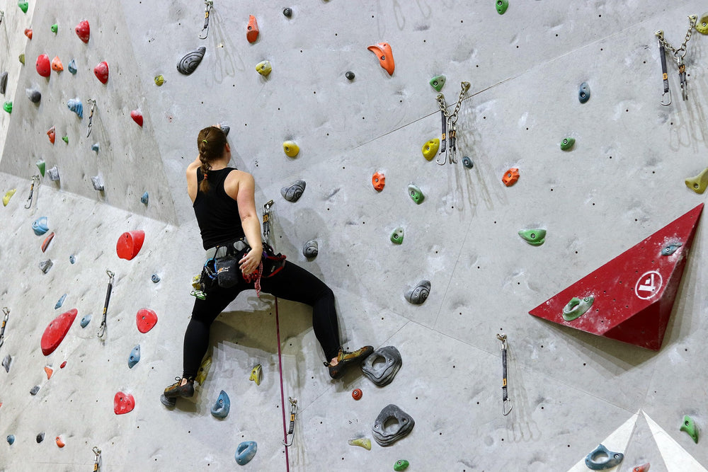 An image of a woman doing rock climbing sports.