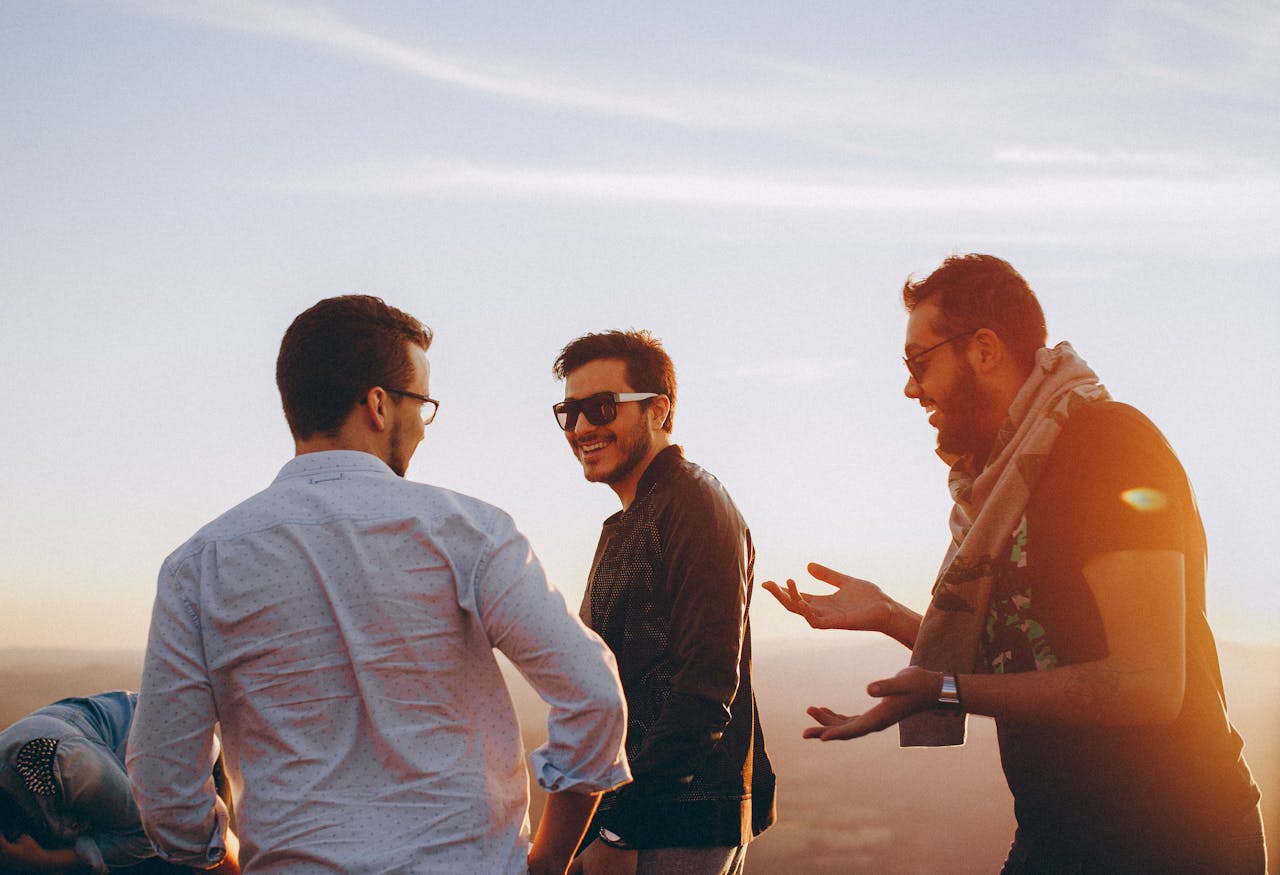 A group of happy men talking.