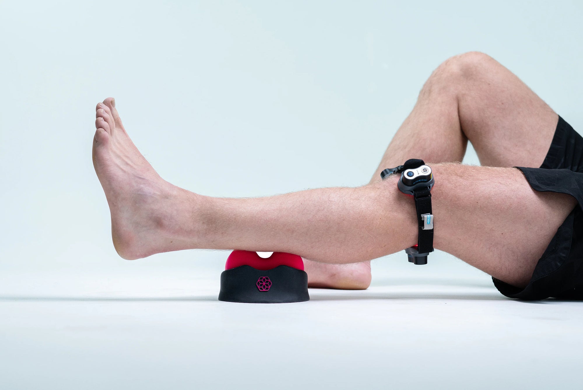 Image shows a man's leg with the myofasical device, the relief+ under it. Image shows what myofascial is and how to use it