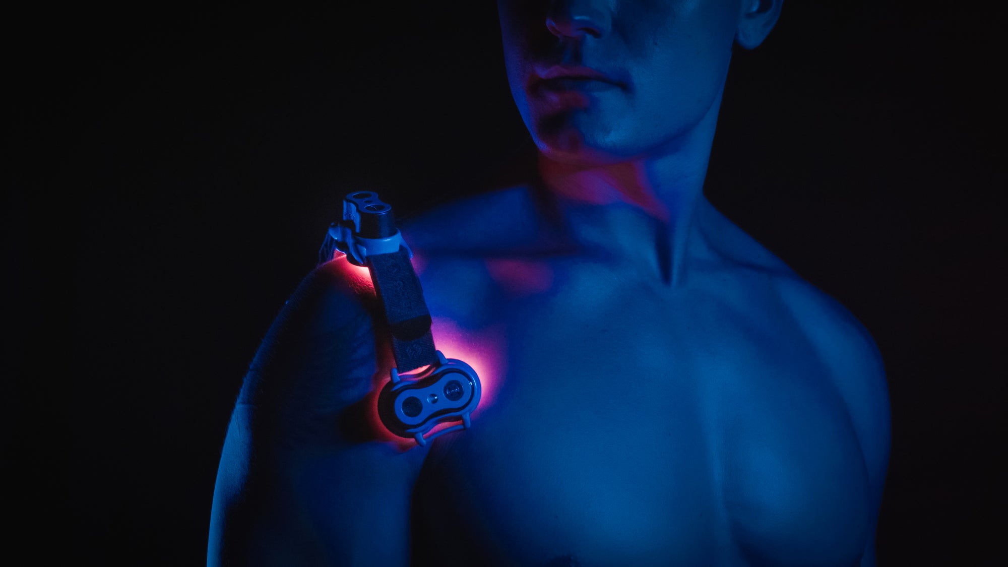 An image of a male's shoulder with Kineon Light Therapy which  promotes optimal blood flow and maintains overall health.